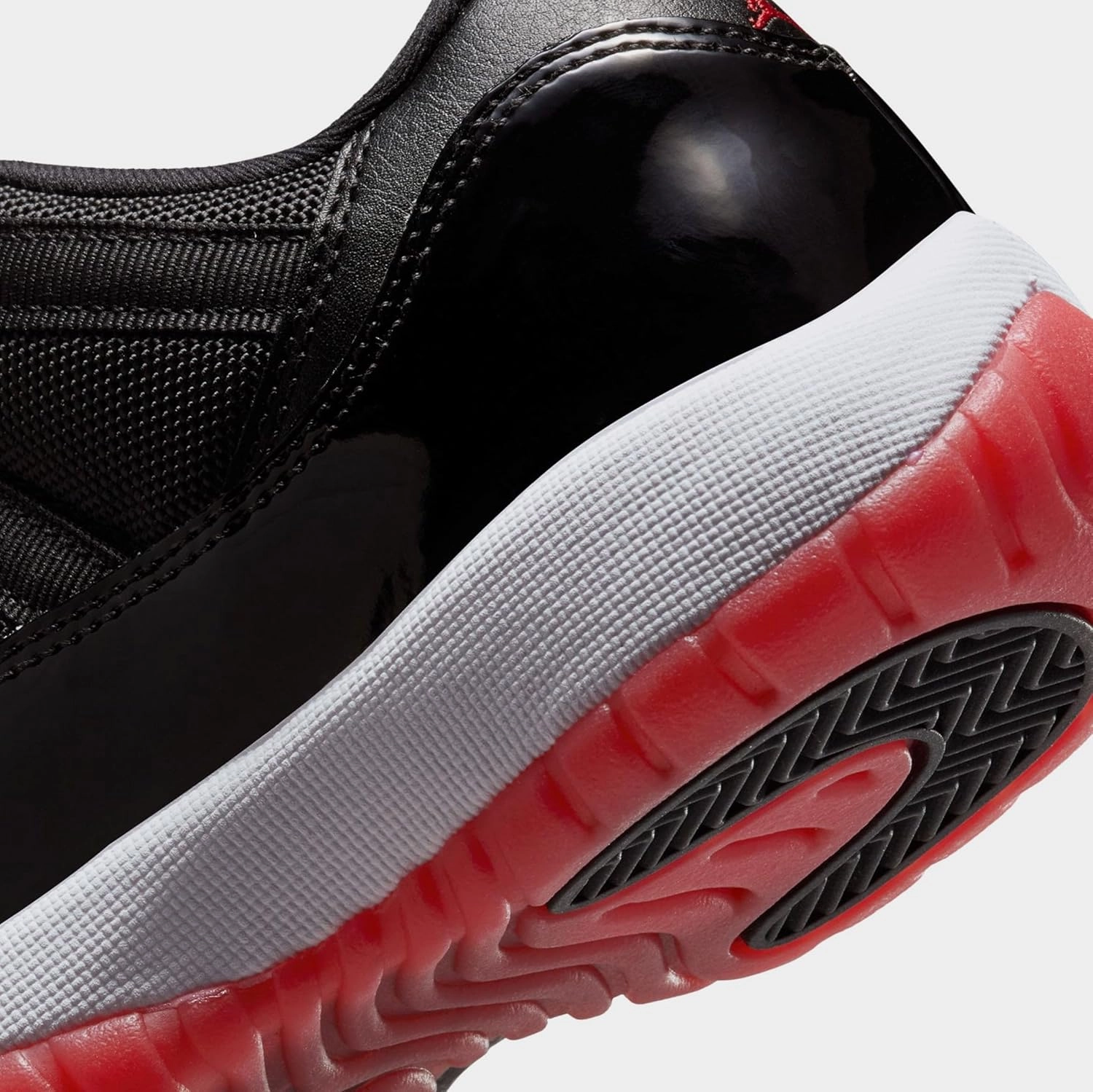 Air Jordan 11 Retro Low Bred Grade School Lifestyle Shoes (Black/Red/White)
