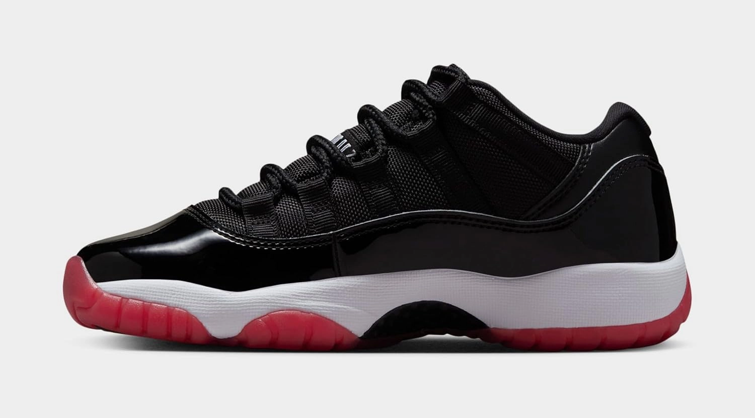 Air Jordan 11 Retro Low Bred Grade School Lifestyle Shoes (Black/Red/White)